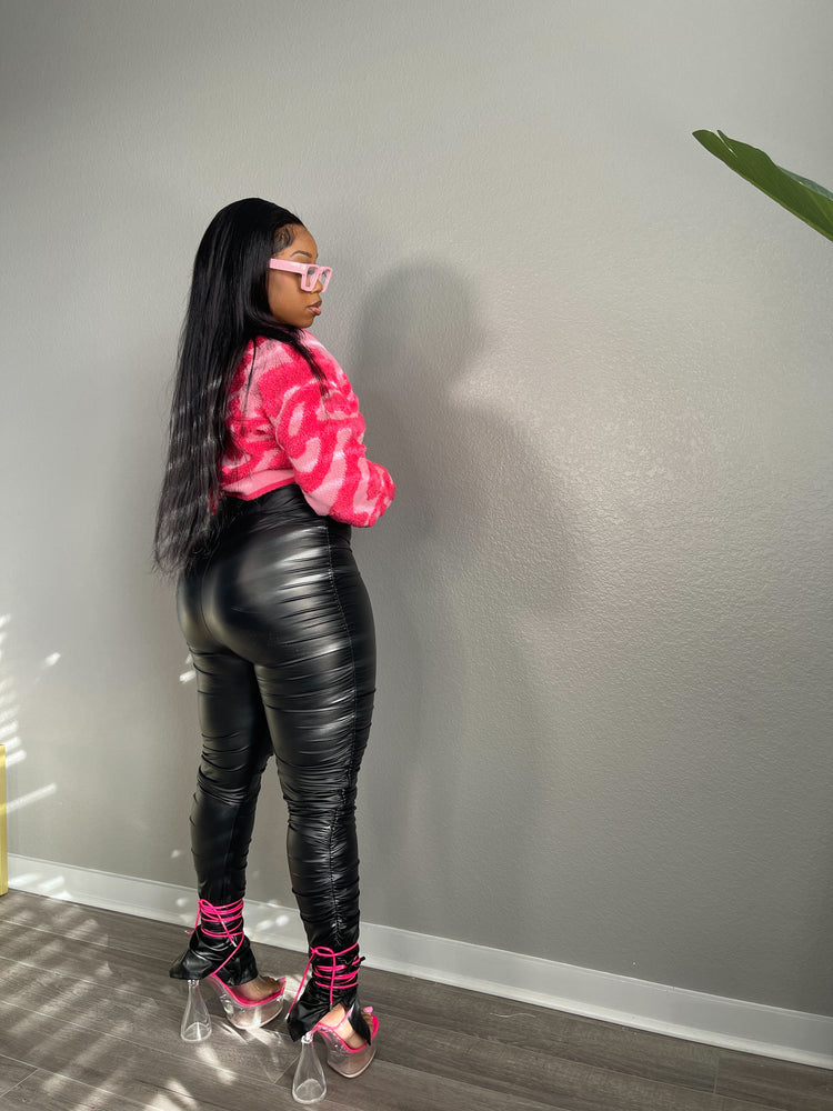 bold and trendy black ruched leggings with slit hem and string