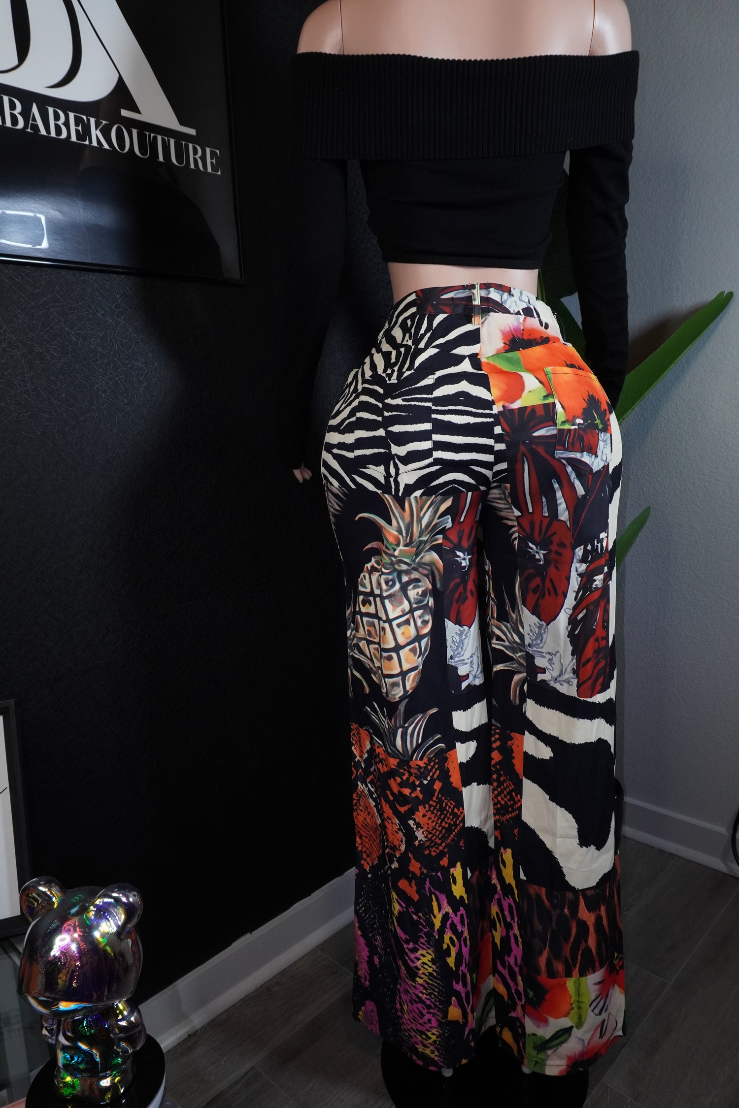 Person wearing colorful patterned pants with a zebra design
