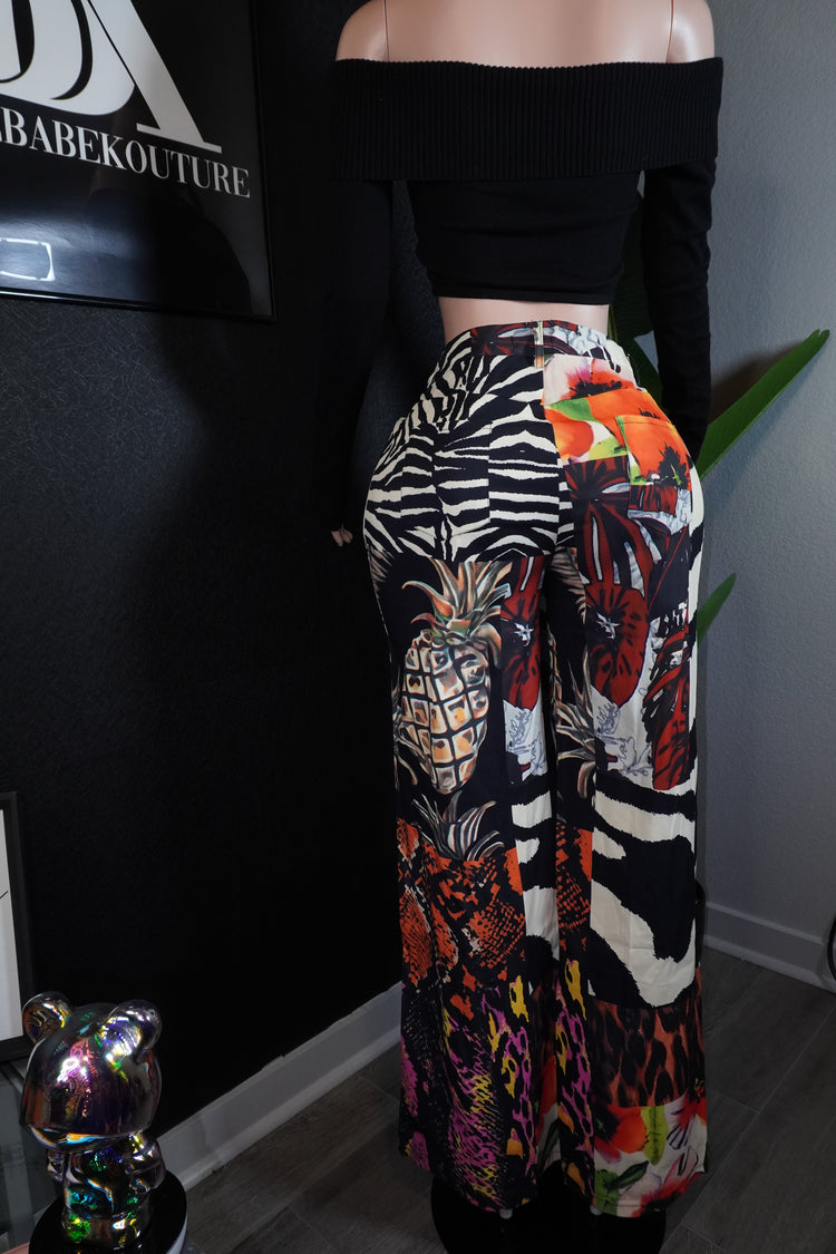 Person wearing colorful patterned pants with a zebra design